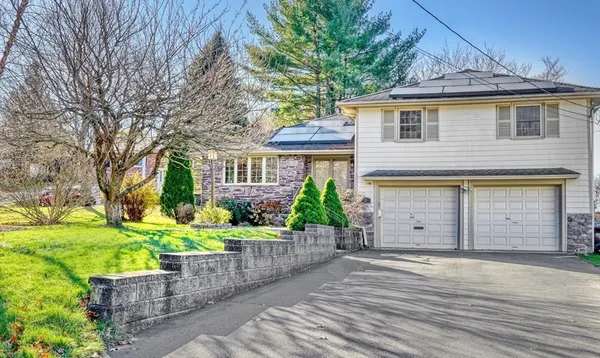 front view of a house with a yard