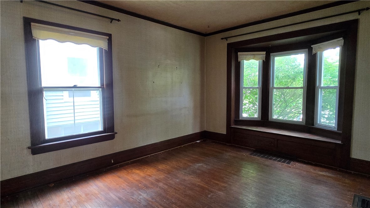 302 Field Street Rochester, NY 14620 - Photo 11 of 32 Oversized windows and hardwood floors in the livin