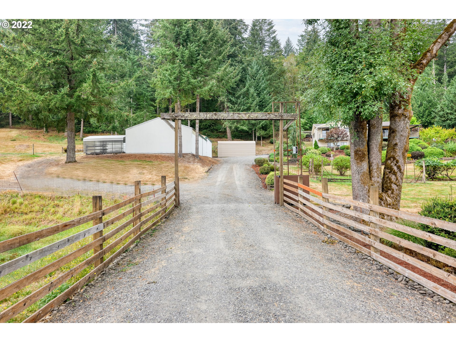 16151 South Hattan Road Oregon City, OR 97045 - Photo 3 of 27 a view of a backyard with wooden fence