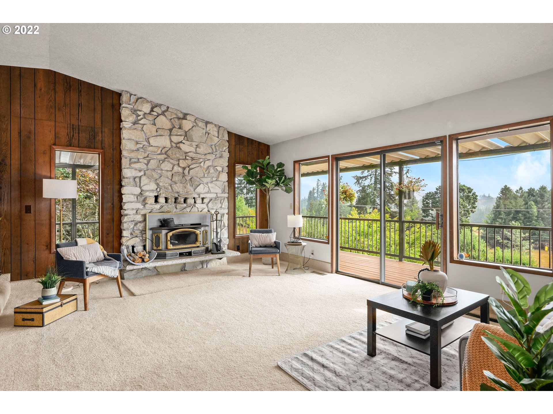 16151 South Hattan Road Oregon City, OR 97045 - Photo 8 of 27 a living room with furniture a fireplace and large windows