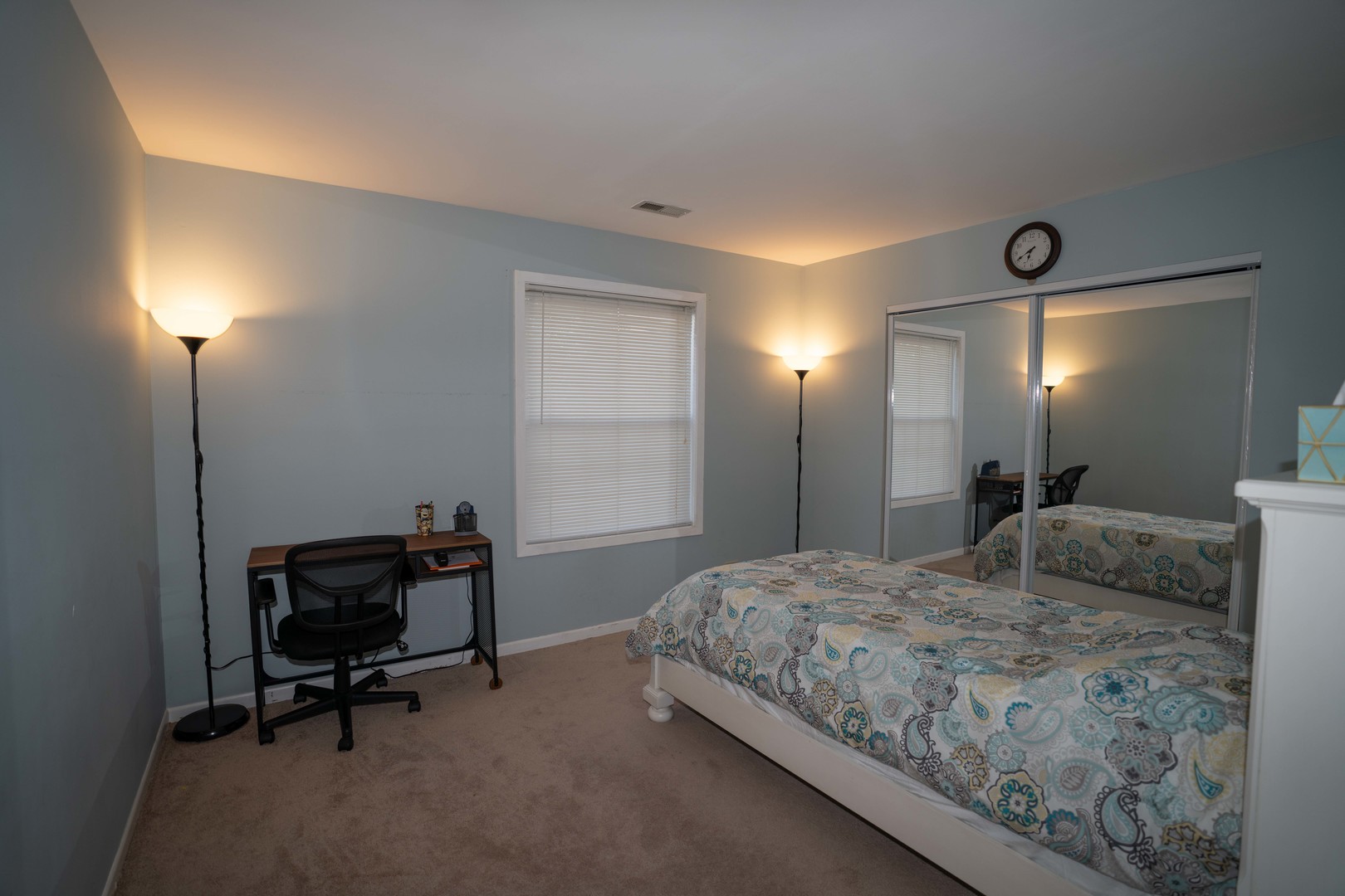 1324 McDowell Road, Unit 203 Naperville, IL 60563 - Photo 11 of 19 a bedroom with a bed and a chair in it