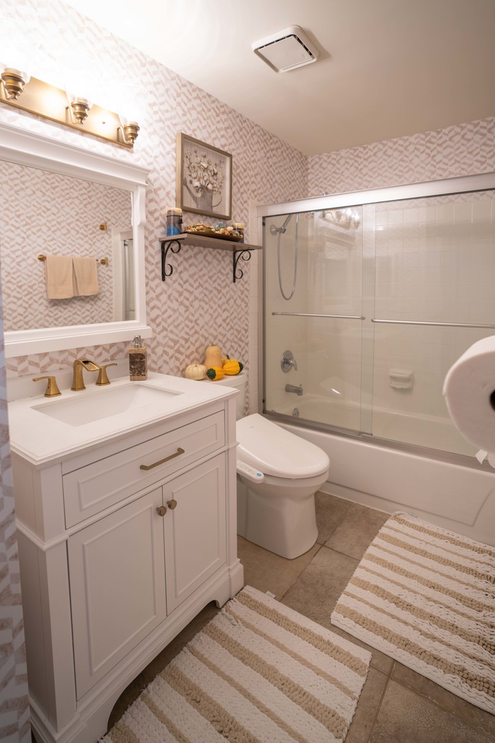 1324 McDowell Road, Unit 203 Naperville, IL 60563 - Photo 13 of 19 a bathroom with a sink a toilet and shower