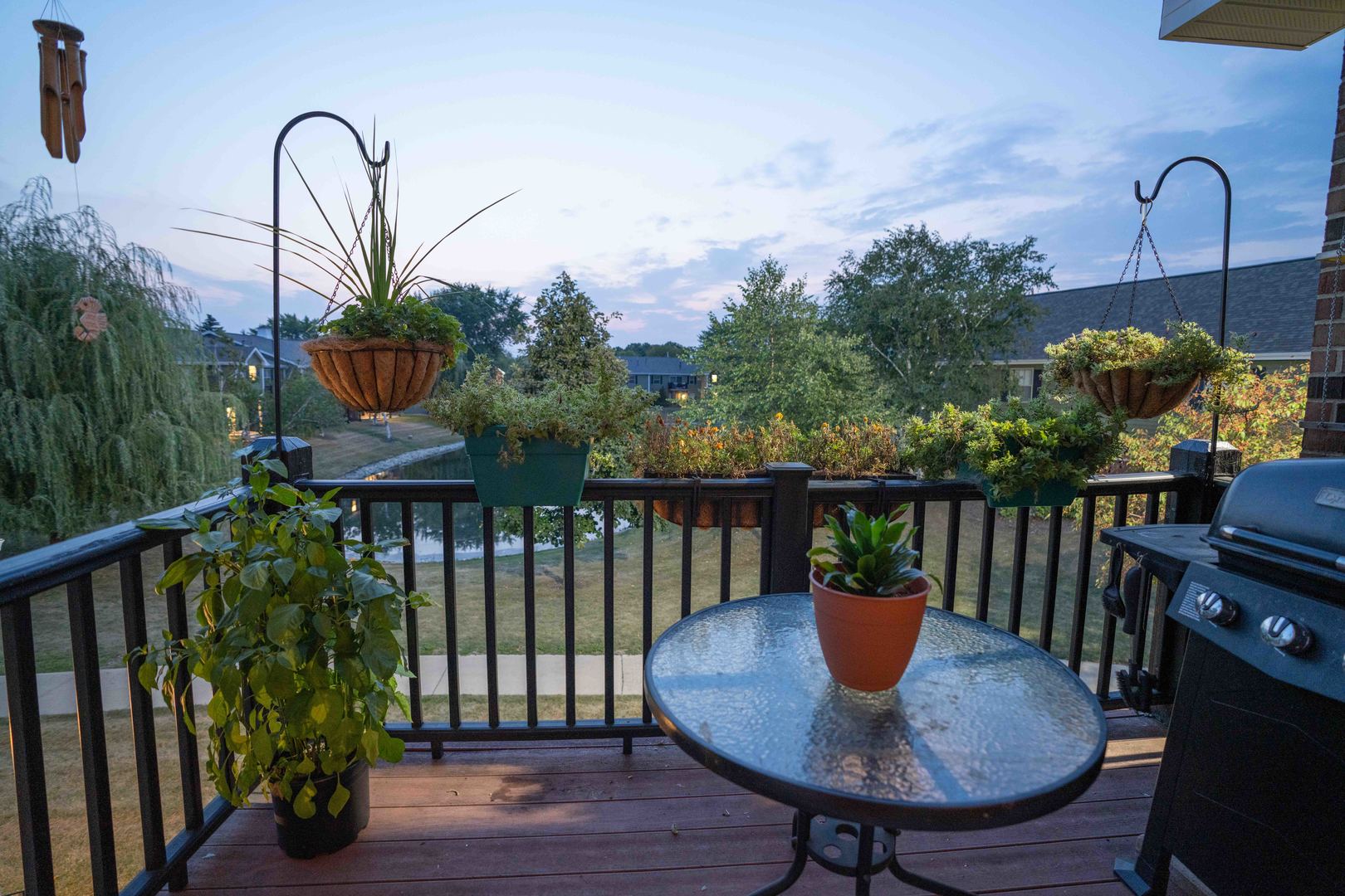 1324 McDowell Road, Unit 203 Naperville, IL 60563 - Photo 3 of 19 a balcony with table and chairs