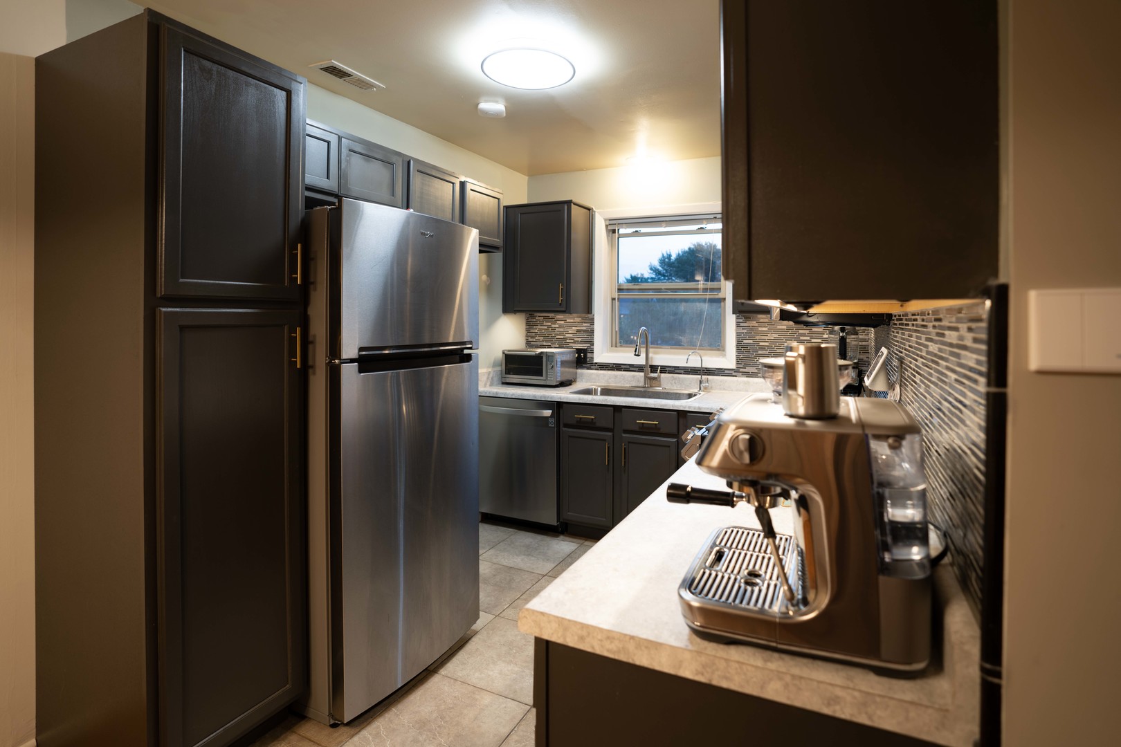 1324 McDowell Road, Unit 203 Naperville, IL 60563 - Photo 8 of 19 a kitchen with a refrigerator and a stove top oven