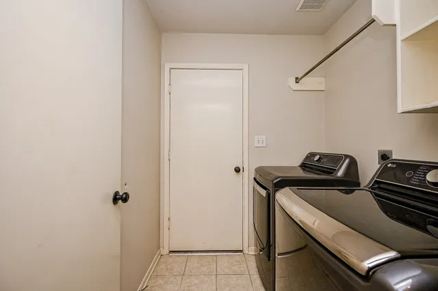 a bathroom with a granite countertop sink a mirror and a shower