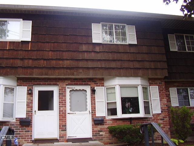 11 Leslie Road, Unit G Bridgeport, CT 06606 - Photo 1 of 1 a front view of a house with a yard