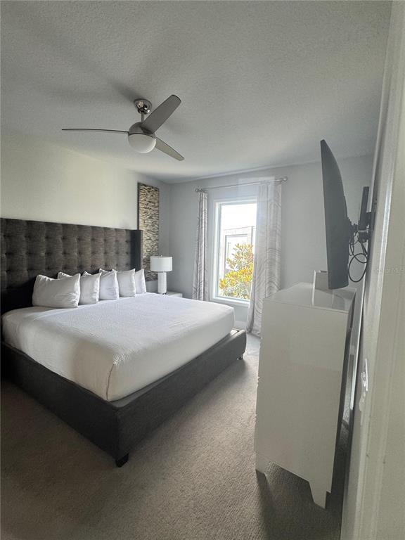 7770 Sandy Ridge Drive, Unit 210 Reunion, FL 34747 - Photo 32 of 42 a bedroom with a bed and window