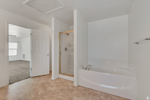 546 Wheatridge Road Tooele, UT 84074 - Photo 24 of 49 Master bathroom with a built-in soaking tub, separate glass-enclosed shower