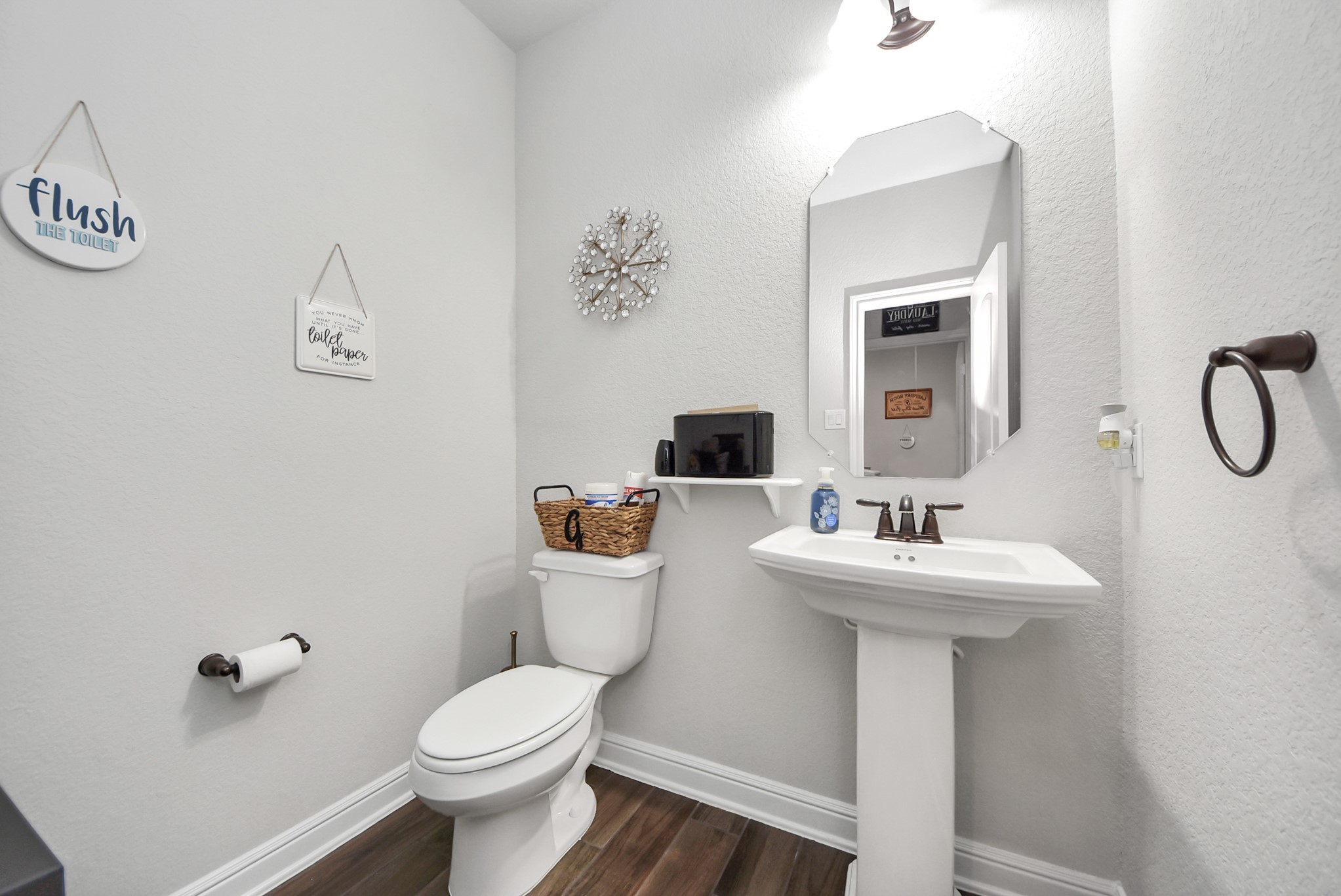 24503 Eucalyptus Way Spring, TX 77373 - Photo 21 of 27 a bathroom with a toilet sink and mirror