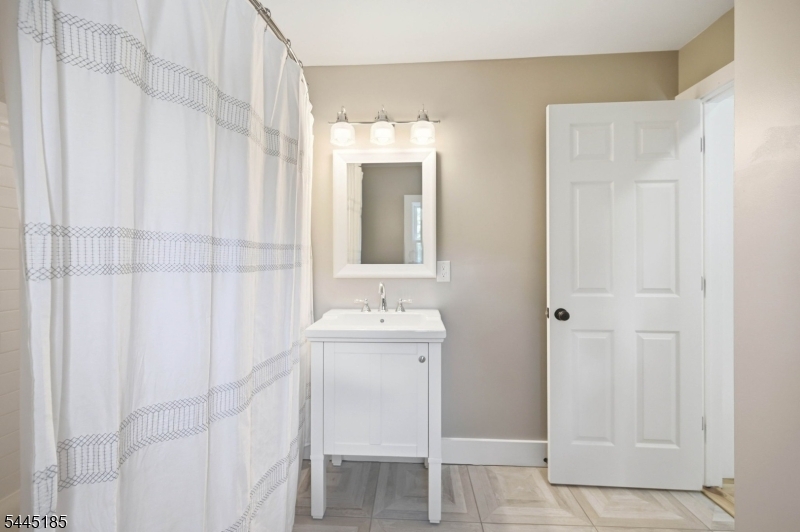 150 Powerville Road Boonton, NJ 07005 - Photo 20 of 34 a bathroom with a sink and a mirror