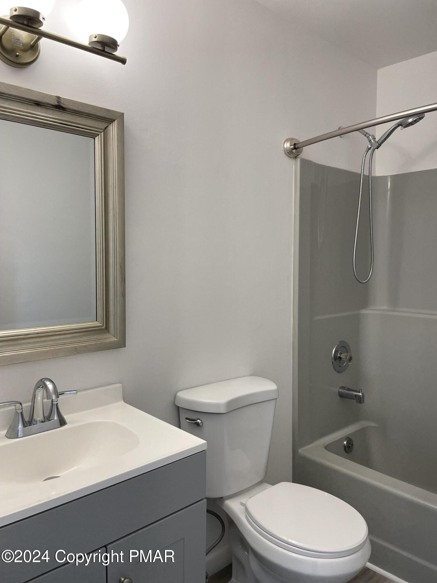 2204 Exeter Court Bushkill, PA 18324 - Photo 20 of 29 a white toilet sitting next to a bathroom sink