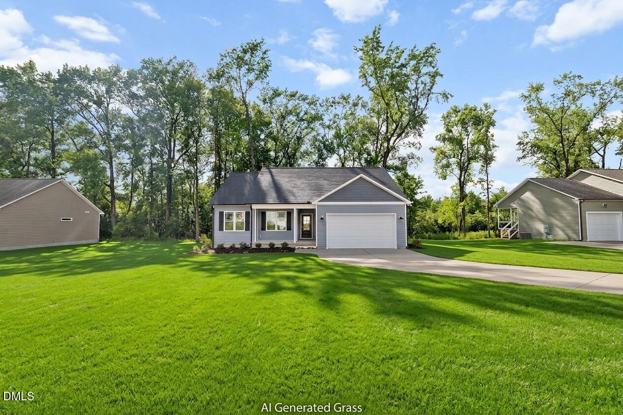 1115 Nor-Am Road Pikeville, NC 27863 - Photo 5 of 40 a front view of a house with a yard