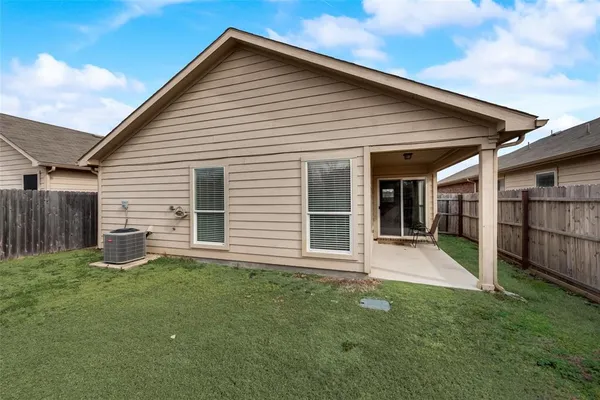 a front view of a house with a yard and porch