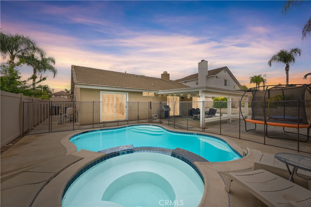 8517 Chesterfield Road Riverside, CA 92508 - Photo 1 of 1 a swimming pool with outdoor seating and yard