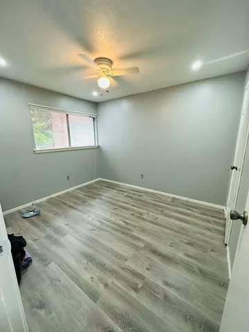 a bathroom with a double vanity sink toilet and shower