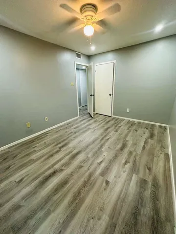 a view of a deck with a large trees