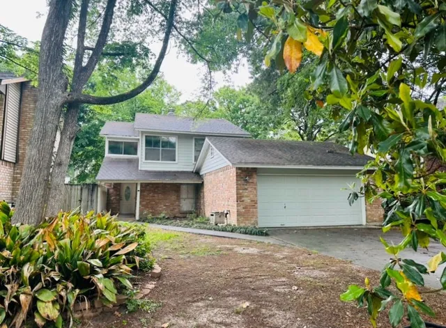 a house with a tree in front of it