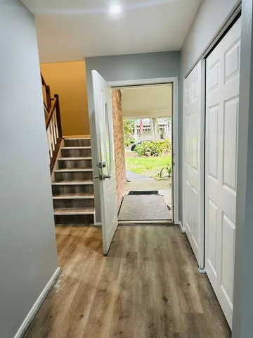 a view of entryway with wooden floor