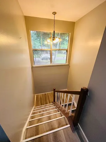 en empty room with window and ceiling fan