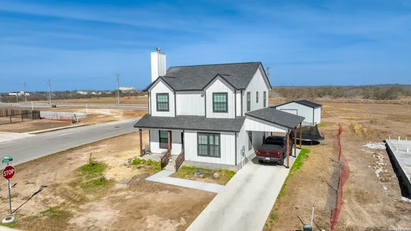a view of a house with a ocean view
