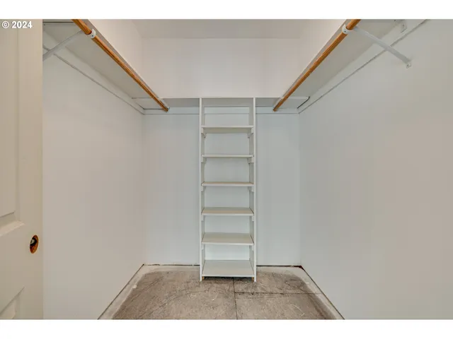 a view of an empty walk in closet