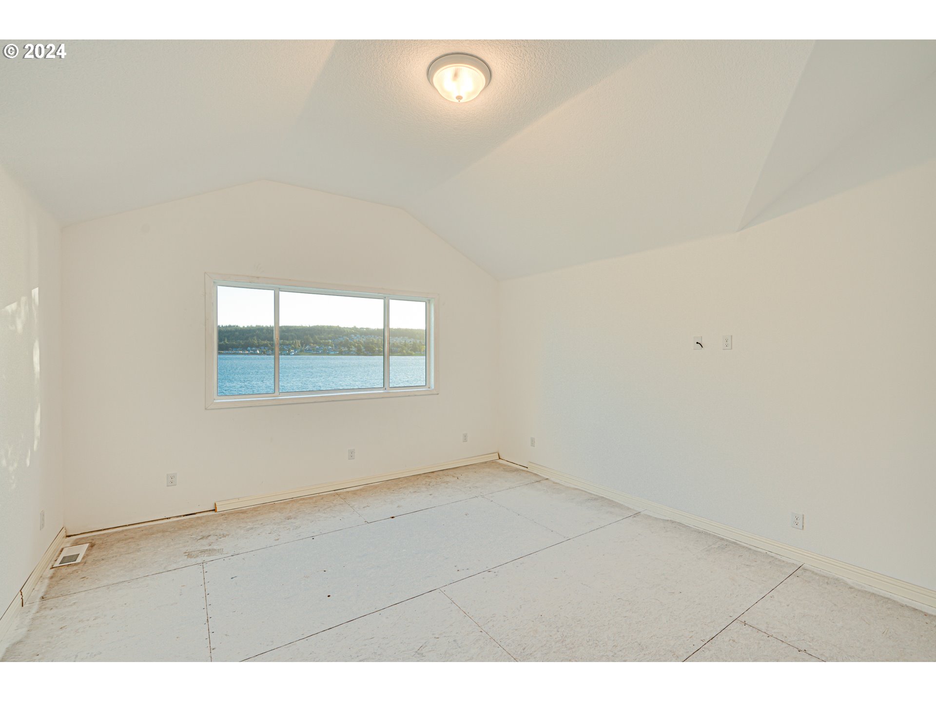2825 Dike Road Woodland, WA 98674 - Photo 28 of 48 a view of an empty room with a window