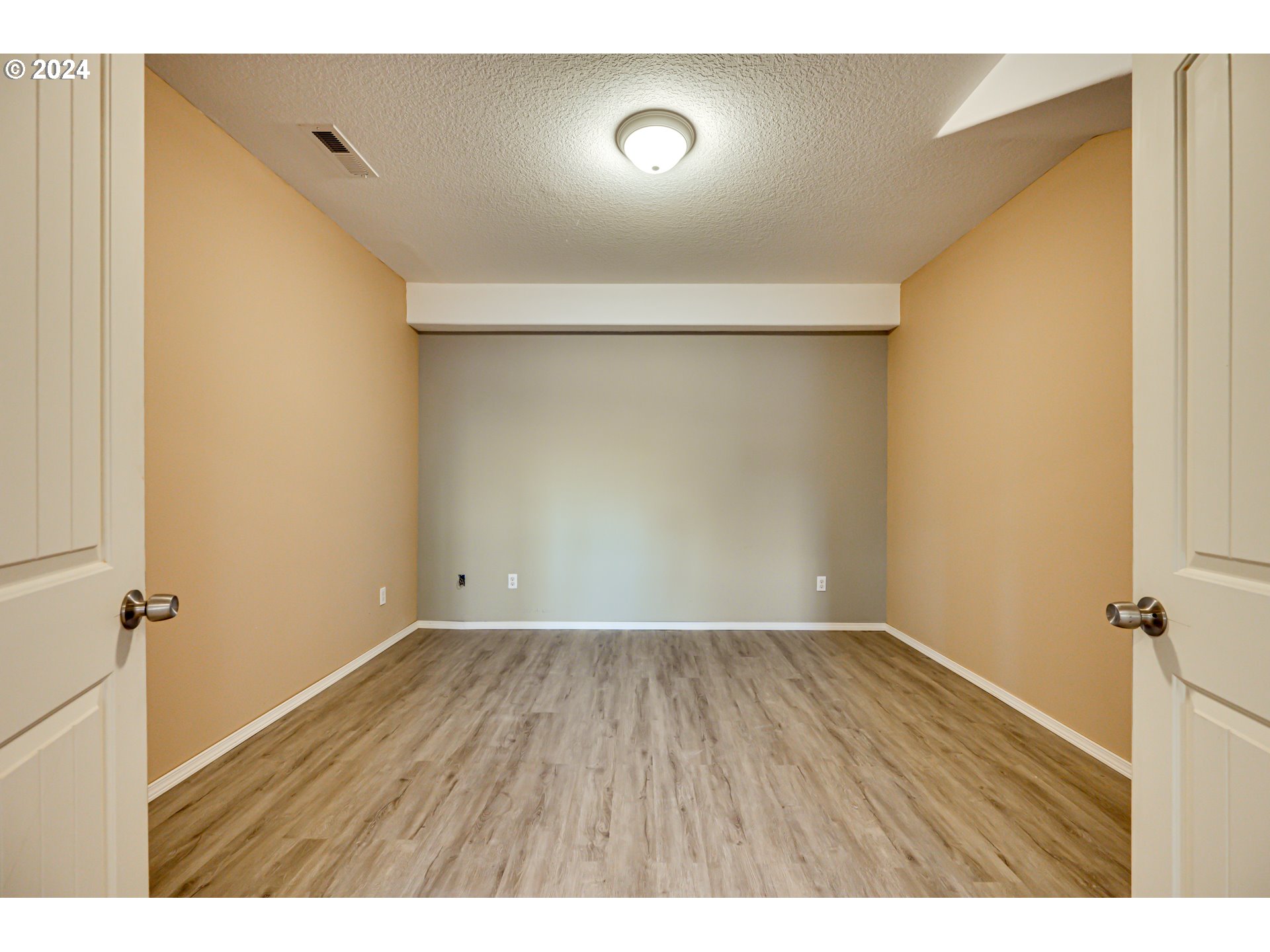 2825 Dike Road Woodland, WA 98674 - Photo 35 of 48 a view of an empty room with wooden floor