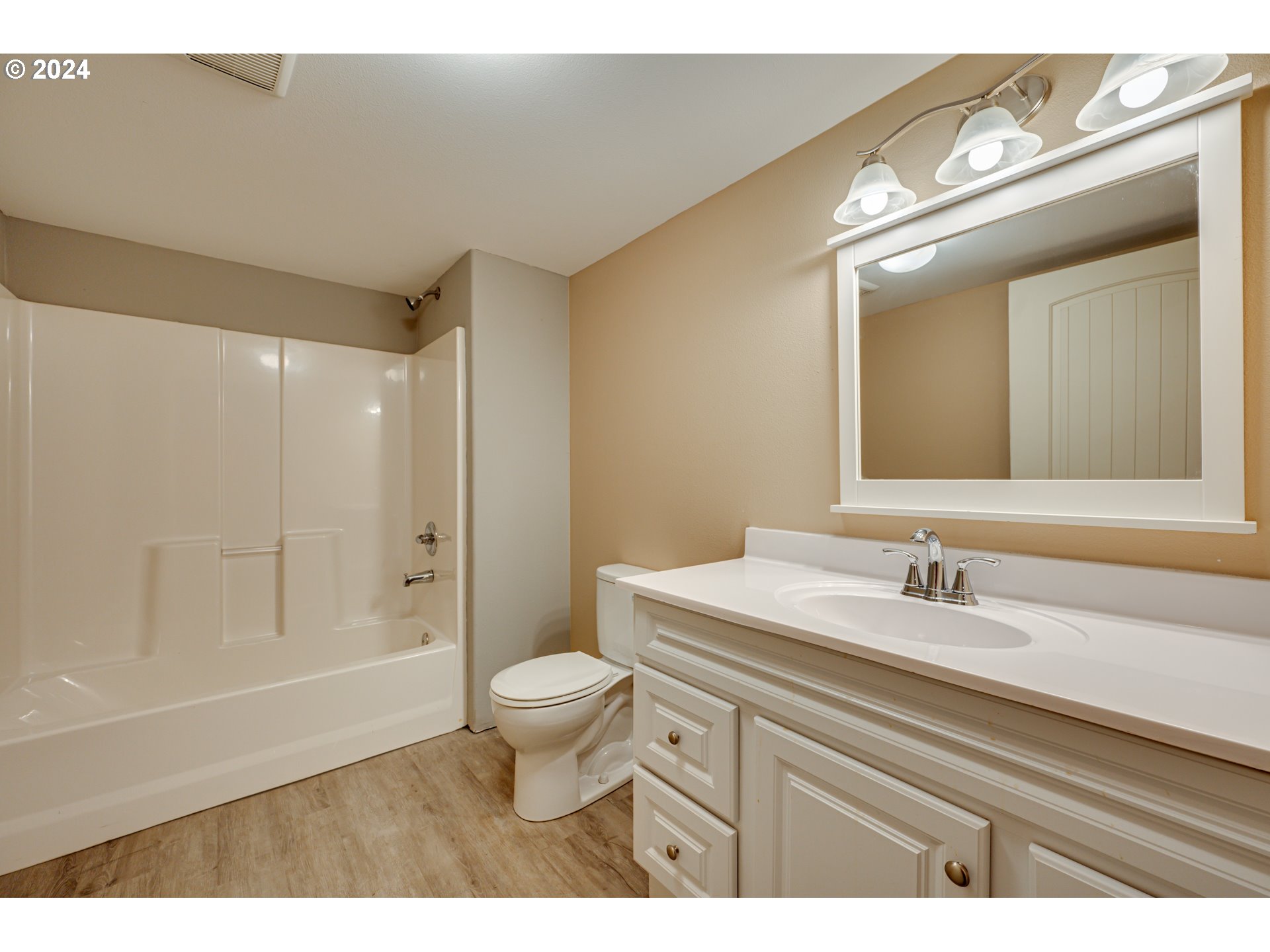 2825 Dike Road Woodland, WA 98674 - Photo 37 of 48 a bathroom with a sink a toilet a large mirror and shower