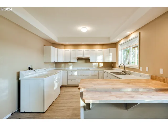 a room with wooden floors and window