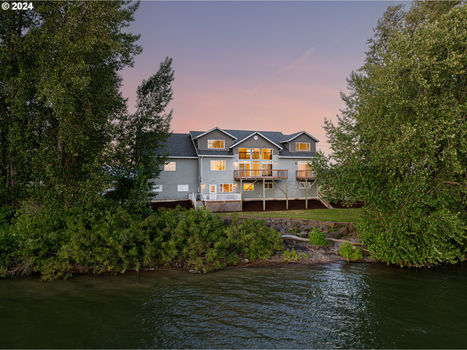 2825 Dike Road Woodland, WA 98674 - Photo 43 of 48 a view of a big house with a big yard and large trees