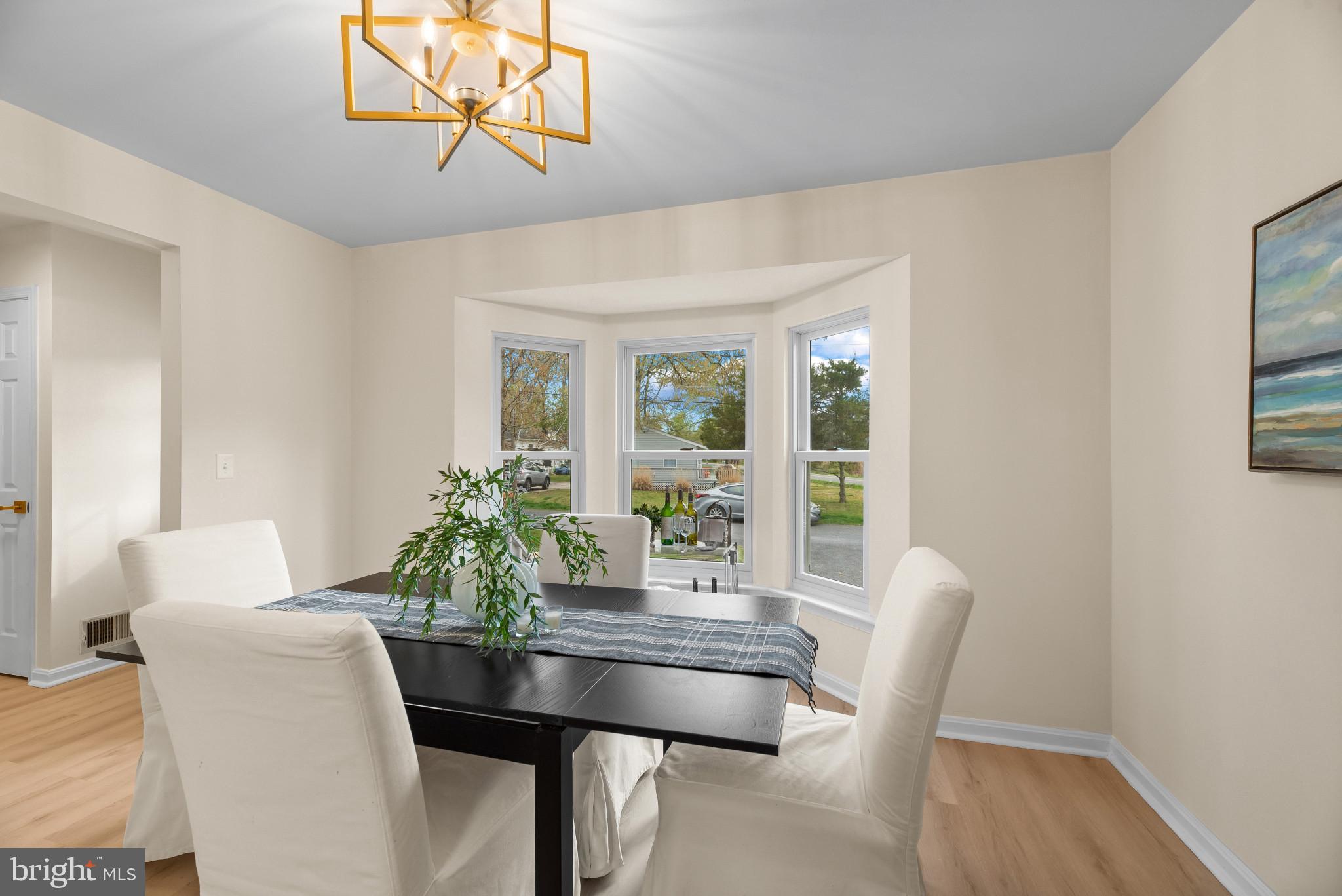 1512 Lincoln Road Shady Side, MD 20764 - Photo 14 of 42 a view of a dining room with furniture window and wooden floor