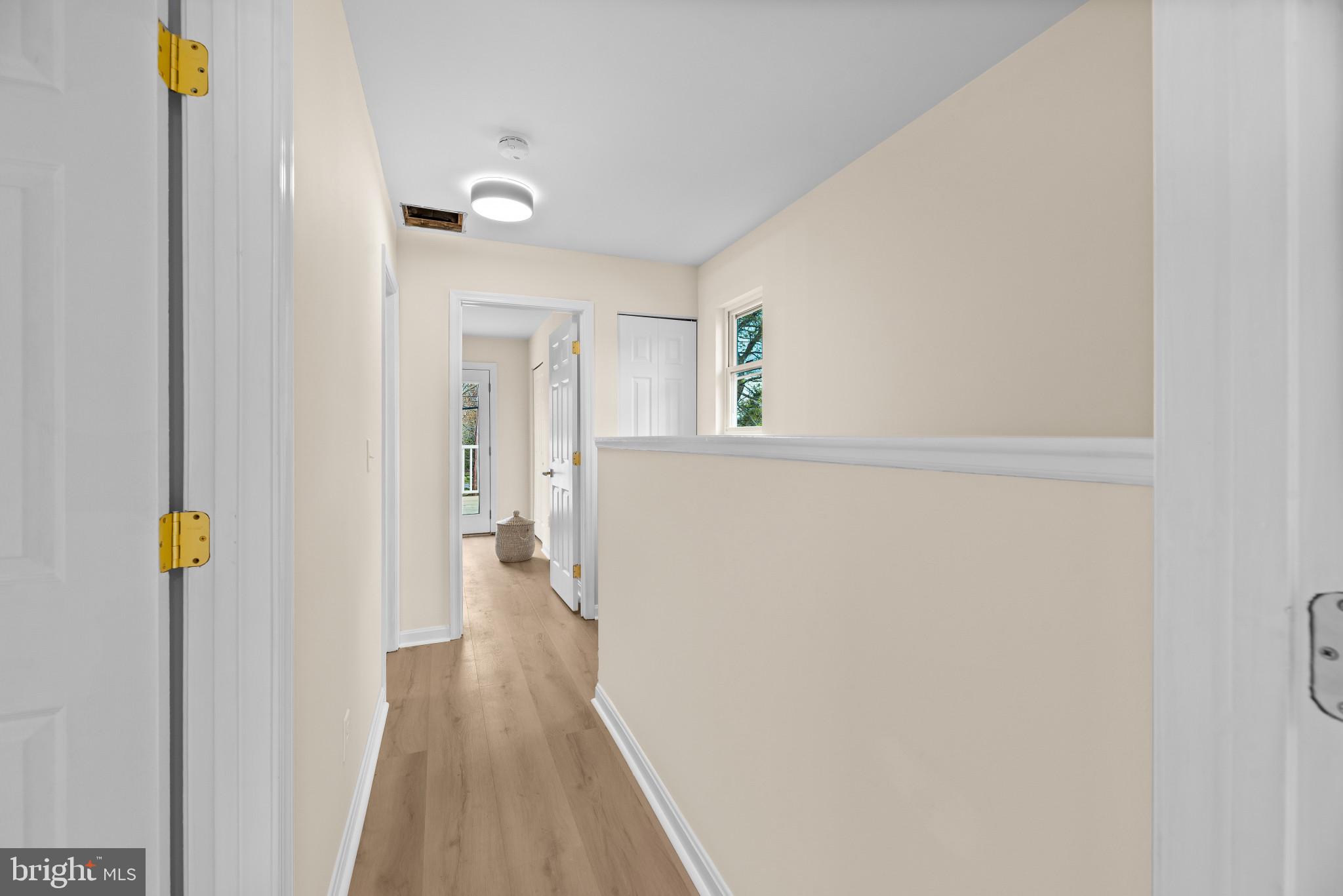 1512 Lincoln Road Shady Side, MD 20764 - Photo 27 of 42 a view of a hallway with wooden floor