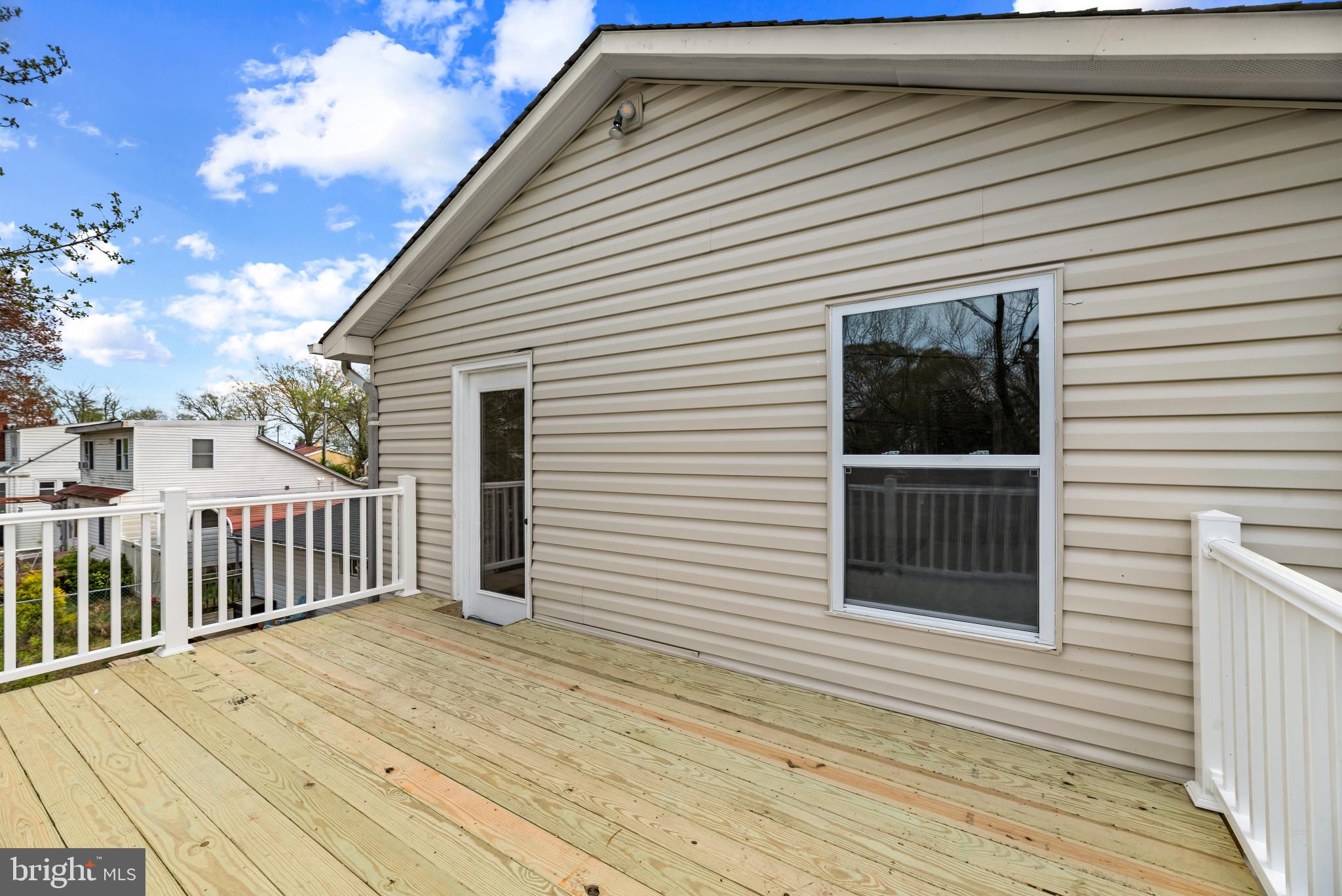 1512 Lincoln Road Shady Side, MD 20764 - Photo 34 of 42 a view of a house with wooden deck