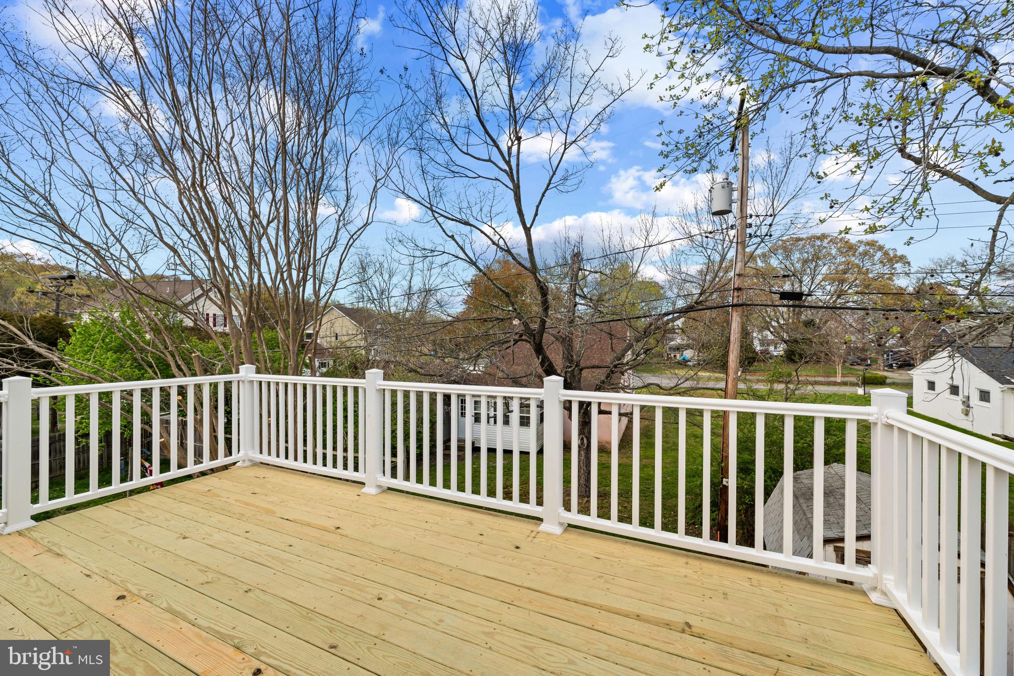 1512 Lincoln Road Shady Side, MD 20764 - Photo 7 of 42 a view of balcony with wooden floor and fence