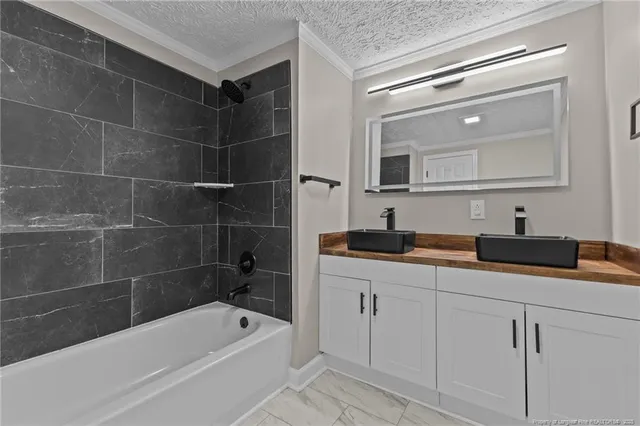 a view of a kitchen with a sink and wooden floor