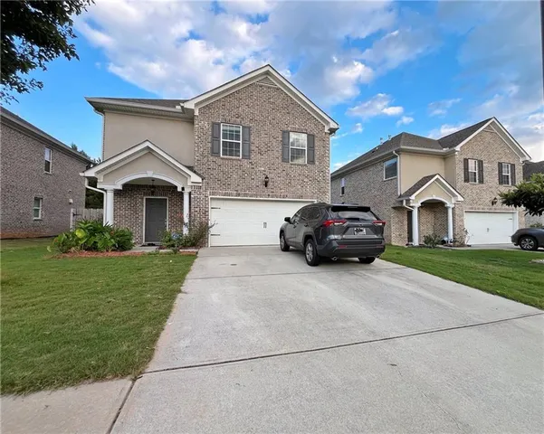 a house view with a garden space