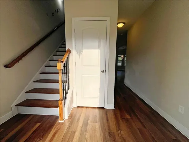 a view of entryway with wooden floor