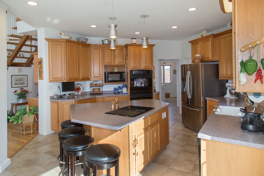 29 Lockheed Boulevard Waynesboro, VA 22980 - Photo 12 of 43 a kitchen with kitchen island granite countertop a sink refrigerator and microwave