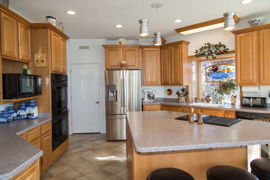 29 Lockheed Boulevard Waynesboro, VA 22980 - Photo 13 of 43 a kitchen with stainless steel appliances granite countertop a refrigerator a stove and a sink with wooden floor