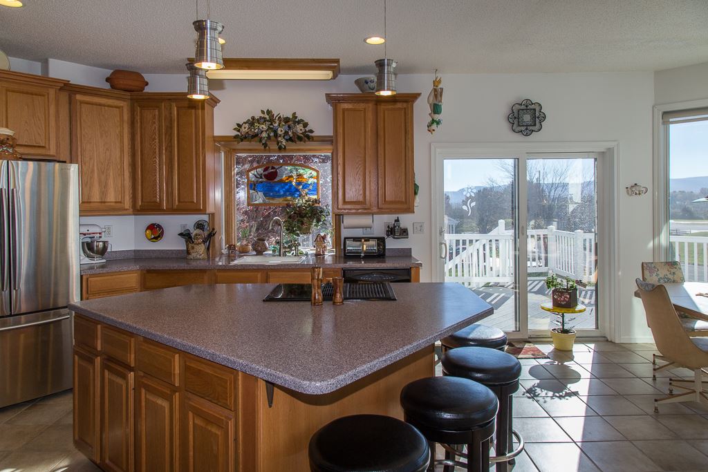 29 Lockheed Boulevard Waynesboro, VA 22980 - Photo 14 of 43 a kitchen with stainless steel appliances granite countertop a sink and a refrigerator