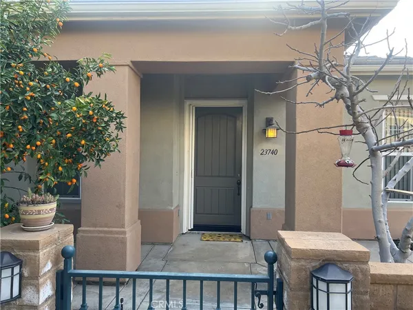 a backyard of a house with outdoor seating