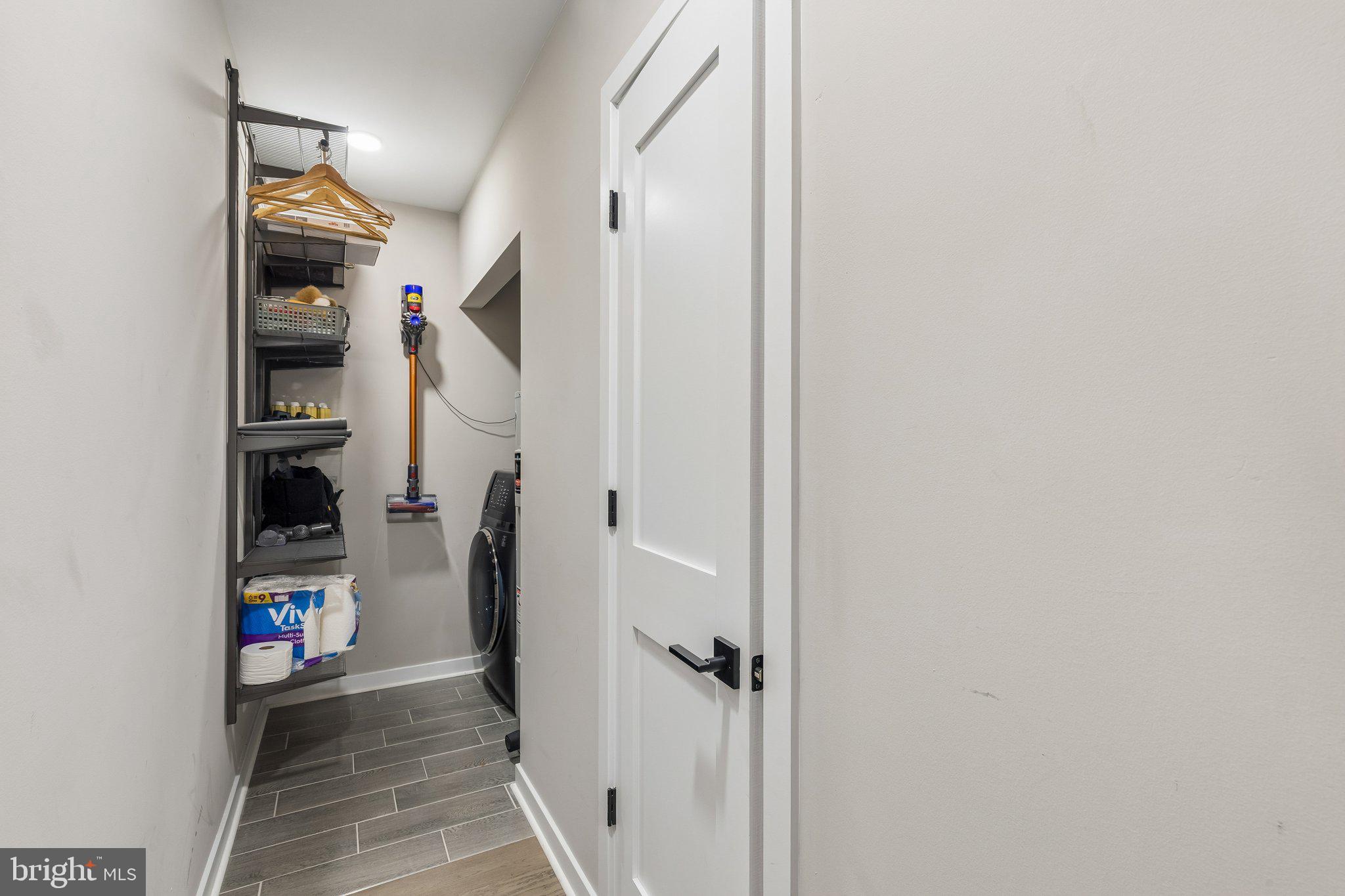 1648-50 Ridge Avenue, Unit 302 Philadelphia, PA 19130 - Photo 27 of 38 a view of a hallway with wooden shelves