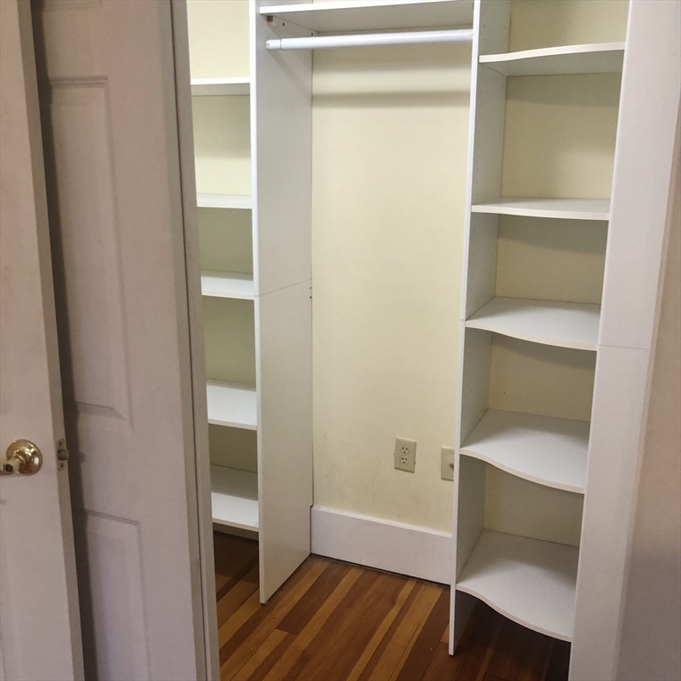27 High Street, Unit 1 Clinton, MA 01510 - Photo 24 of 30 a walk in closet with wooden floor