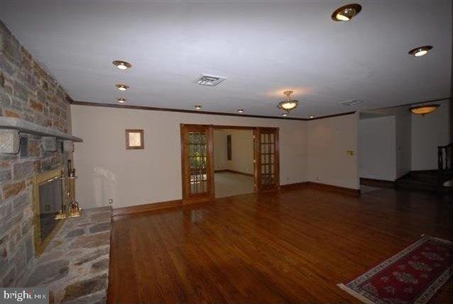 505 Gun Road Halethorpe, MD 21227 - Photo 4 of 19 LIVING ROOM 24 X 18 WOOD BURNING STONE FIREPLACE