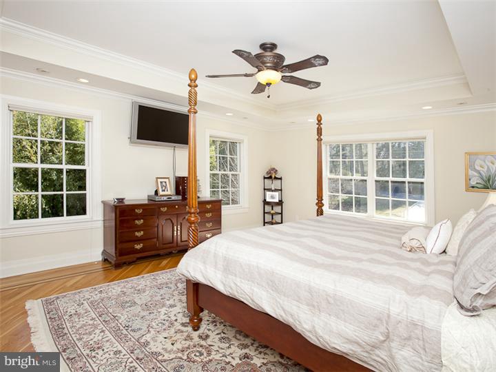 271 Edgerstoune Road Princeton, NJ 08540 - Photo 13 of 17 a spacious bedroom with a bed and wooden floor