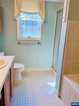 a bathroom with a sink a toilet and a tub