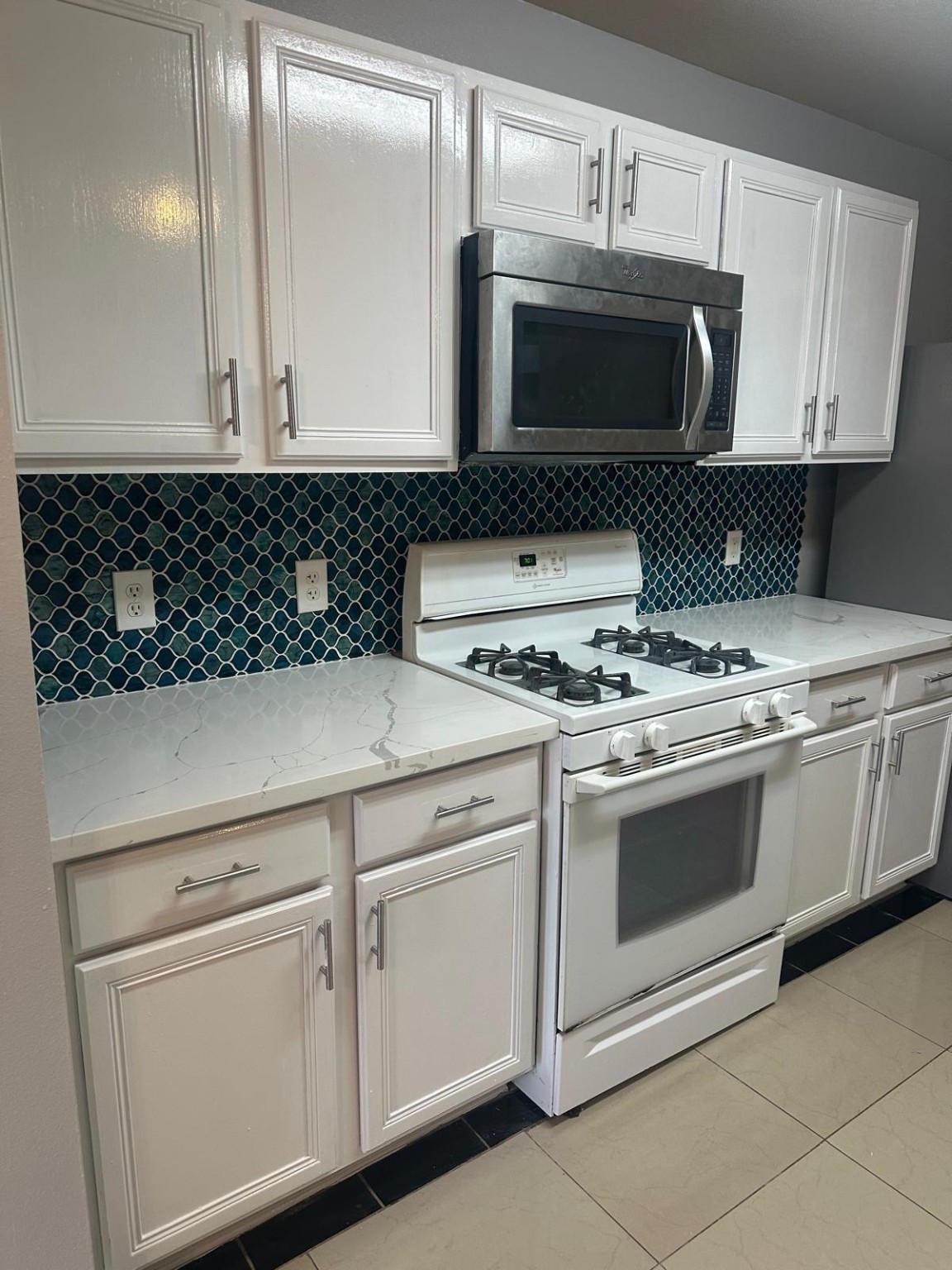 19818 Lindenwick Court Cypress, TX 77433 - Photo 12 of 35 a stove top oven sitting inside of a kitchen