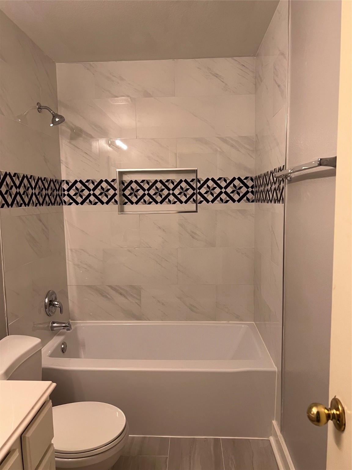 19818 Lindenwick Court Cypress, TX 77433 - Photo 22 of 35 a bathroom with a bathtub and a toilet