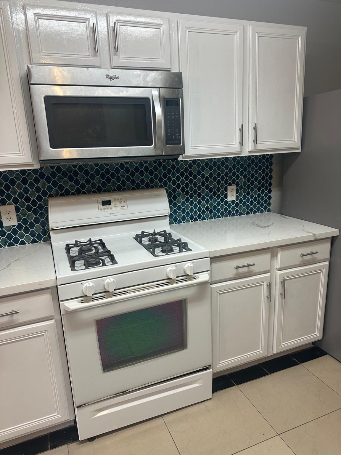 19818 Lindenwick Court Cypress, TX 77433 - Photo 10 of 35 a white stove top oven sitting inside of a kitchen