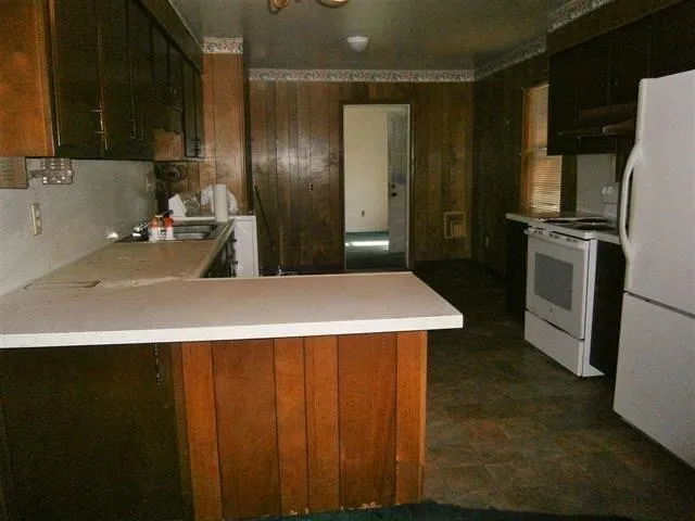 a view of a room with a wooden floor